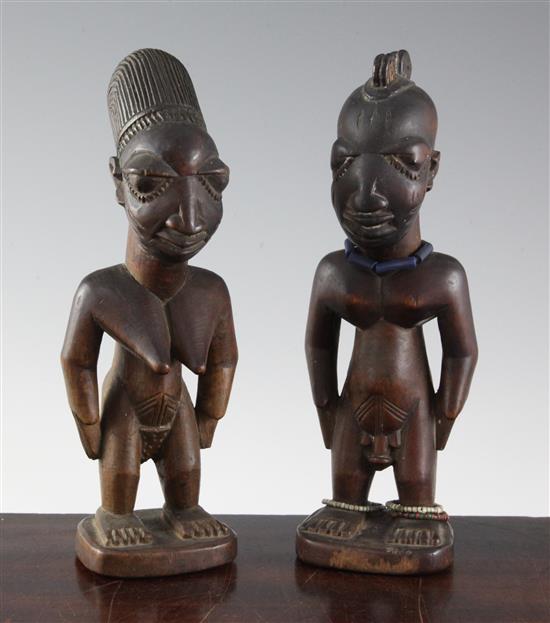 Two Yoruba wood figures of a man and a woman, late 19th/early 20th century, 9in.